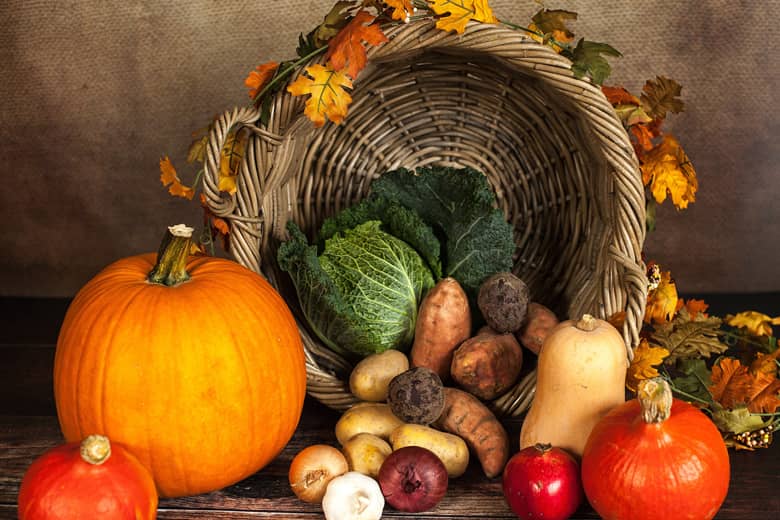Seasonal Autumn fruit and vegetables with basket.
