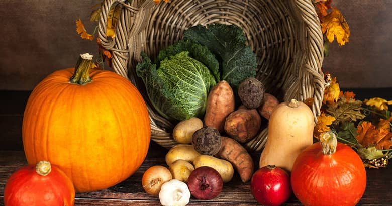 Seasonal Autumn fruit and vegetables with basket.