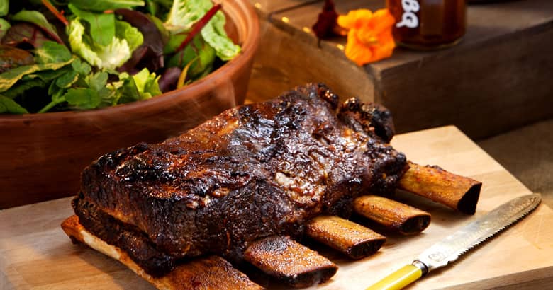 A barbecue feast with ribs and salad by PenniBlack.