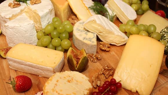 Cheese platter with fruit.