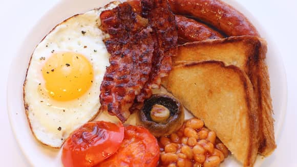 Full English breakfast with egg and bacon.