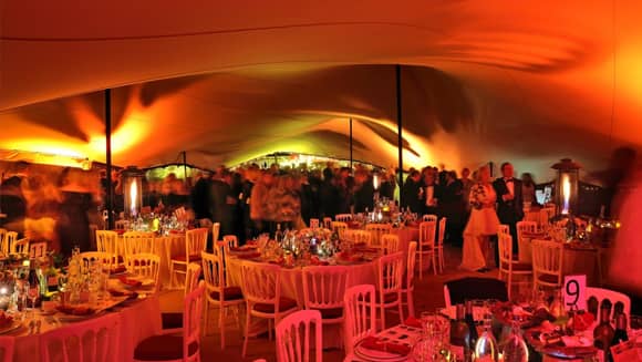 Gold and red themed venue with matching lighting.