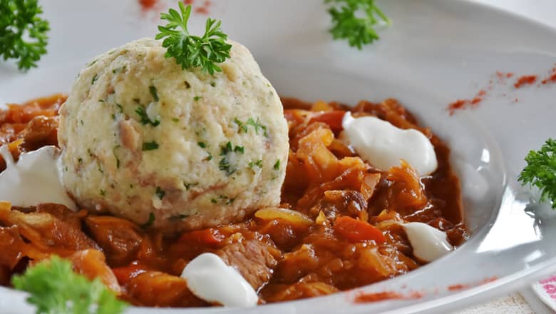 A bowl of Goulash and Dumplings.