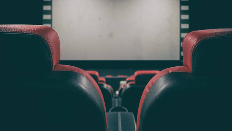 Movie theatre seats with screen.