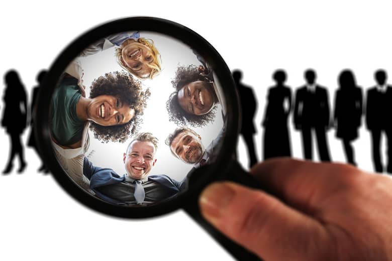 Magnifying glass focussed on a team.