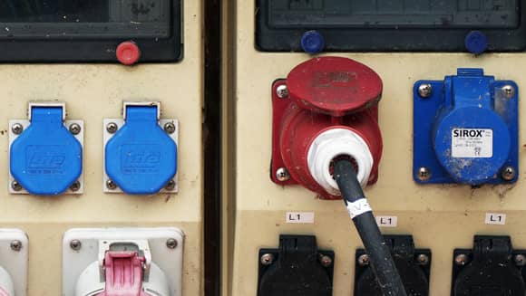 Power cable plugged into a distribution box.