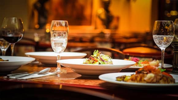 Italian restaurant table with food and glasses.