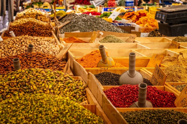 Spice market with colourful spices and produce.
