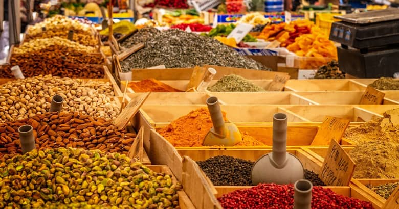 Spice market with colourful spices and produce.