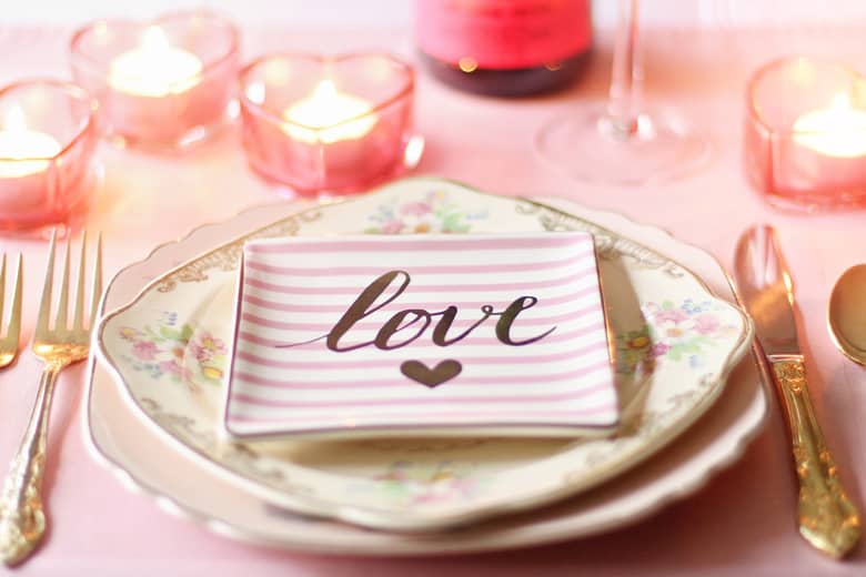 Table set for Valentine’s Day with the centre plate which says Love.