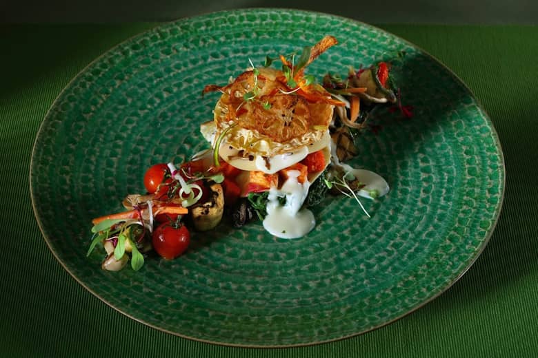 A vegan dish by PenniBlack on green plate.