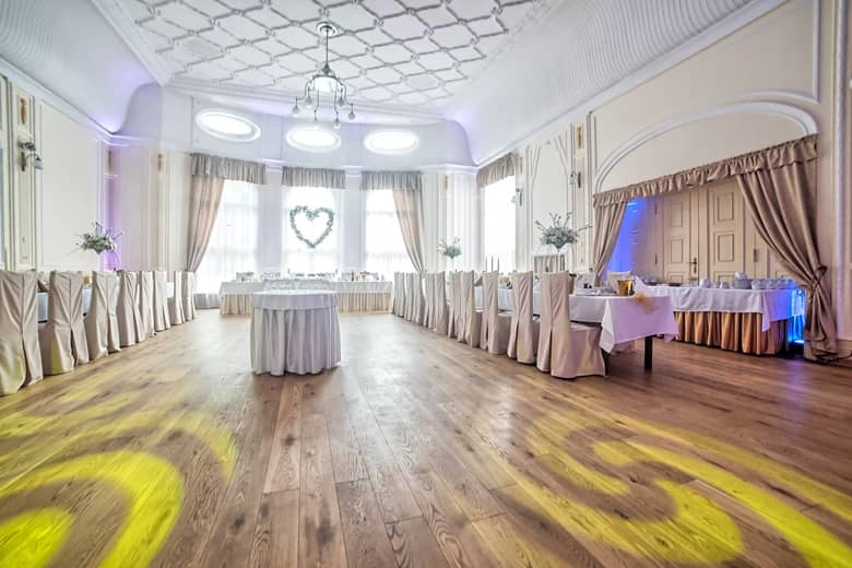 A venue setup for a wedding reception and dance.