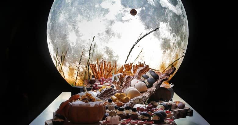 Projected moon over the harvest table.