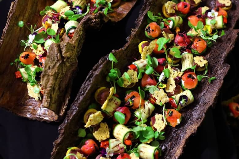Bark platters filled with canapés ready for service.