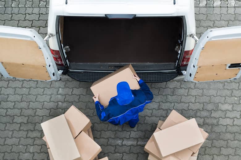 Delivry driver loading a van.