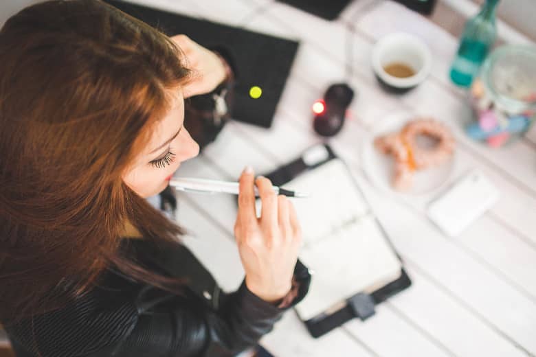 Woman planning an event in a diary.
