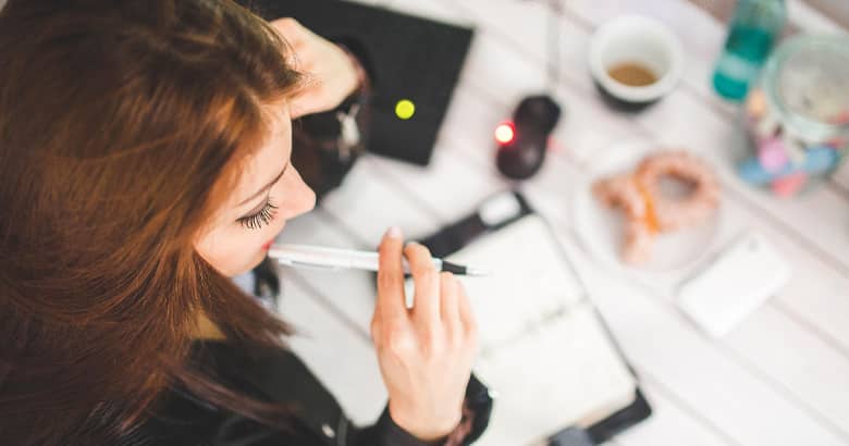 Woman planning an event in a diary.