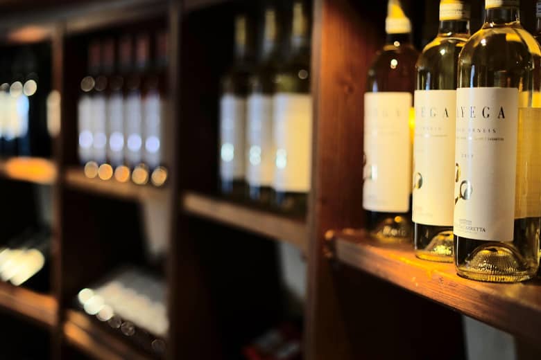 Wine rack with a selection of wines on display.