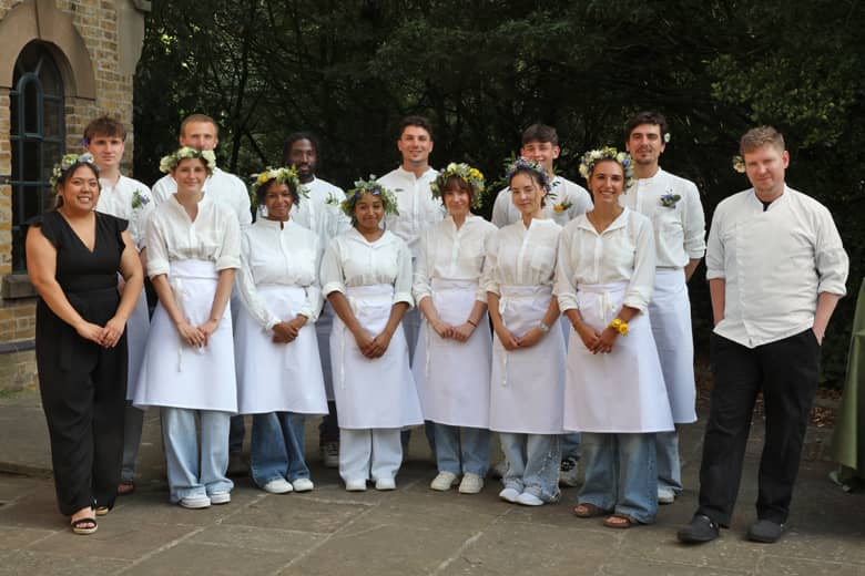 The PenniBlack team dressed with floral crowns.