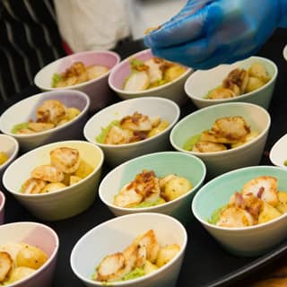 Chef preparing the bowl food.