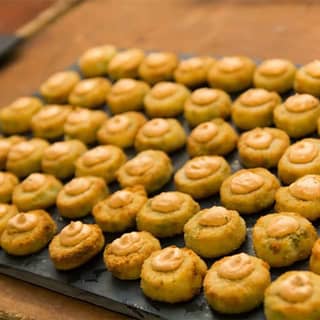 Pea and feta risotto cake with smoked paprika cream canapés.