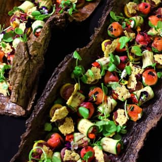 Bark platters filled with canapés ready for service.