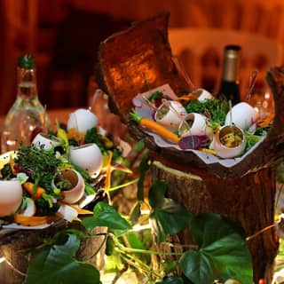 The central winter garden themed feast with egg shells filled with pumpkin mousse and truffle foam.
