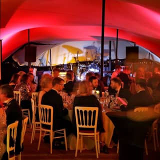 Guests sitting down and dining on the winter themed feast.