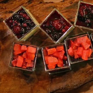 Mini dessert pots of panacotta and berry compote.