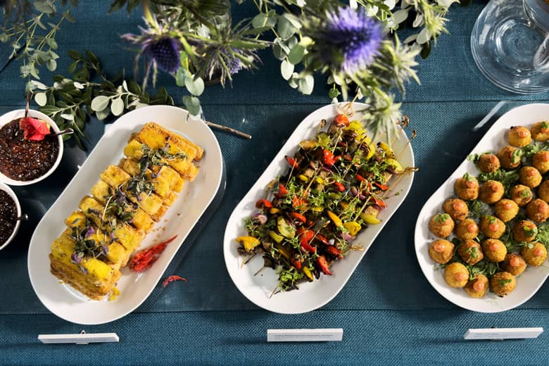 Buffet setup including grilled Mediterranean vegetable skewers with rosemary and lemon myrtle.