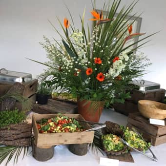 Themed buffet spread with floral decorations.