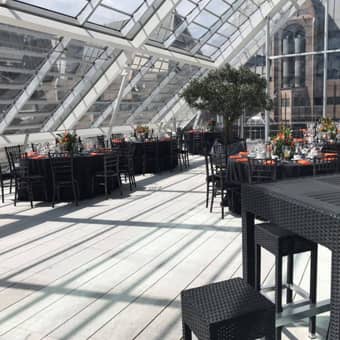 The venue with table settings and stunning views over London.