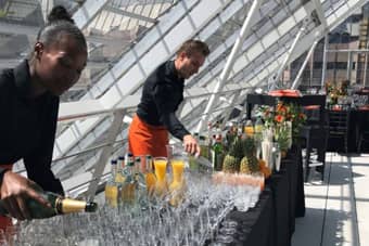 PenniBlack Team pouring Champagne Bellinis.