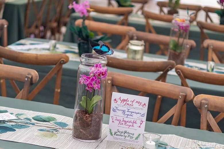 Table decorations and cocktail menus at the Garden Party.