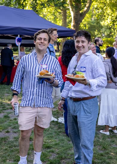 Guests enjoying the food at the Fourth of July event.