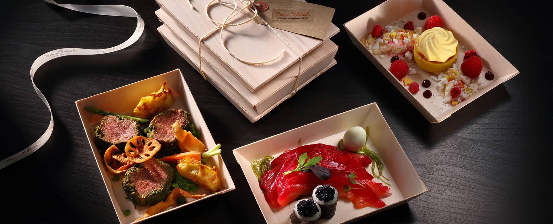 PenniBlack wooden box with starter, main and desssert.