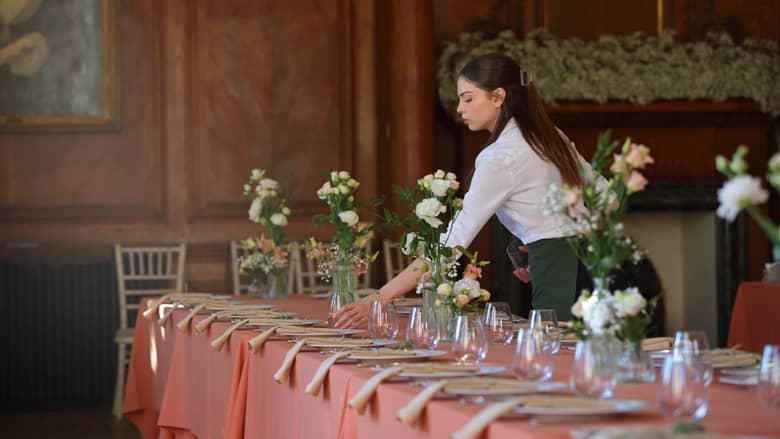 Waitress Staff Placing Table Settings.