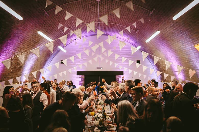 Guests raising a toast at AMP Studios.