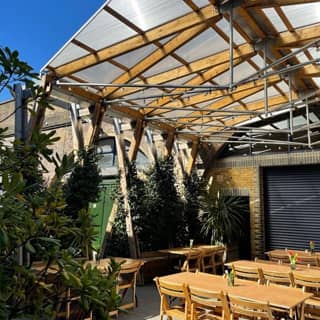 The outside Timber Pergola with seating.