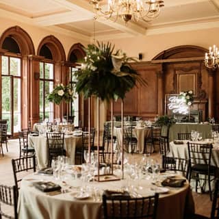 Dining setup in the Portrait Room with table centres.