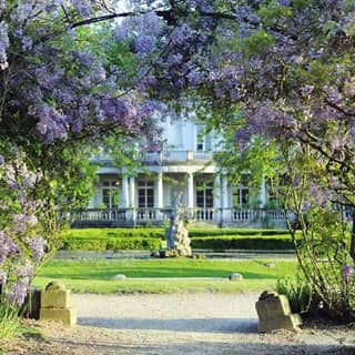 Floral arch at Grove House with the fountain in the distance.