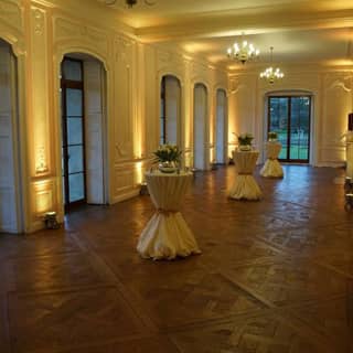 The Terrace Room with reception pedestals draped in cloth.