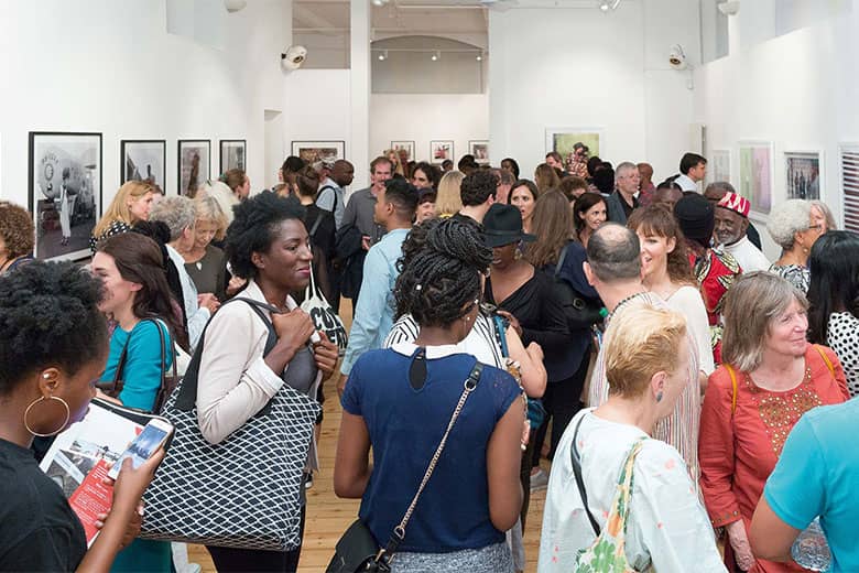 Guests attending an exhibition at the October Gallery.