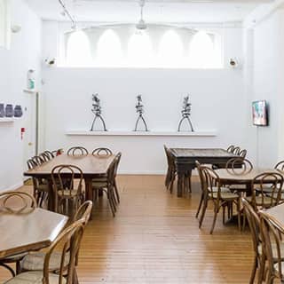 The refectory at the October Gallery seup for dining.