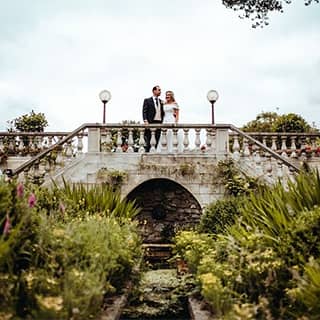 Bride and groom outside on the terrace.
